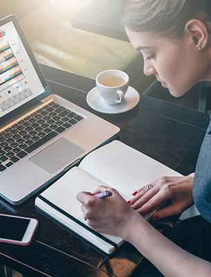 woman taking notes